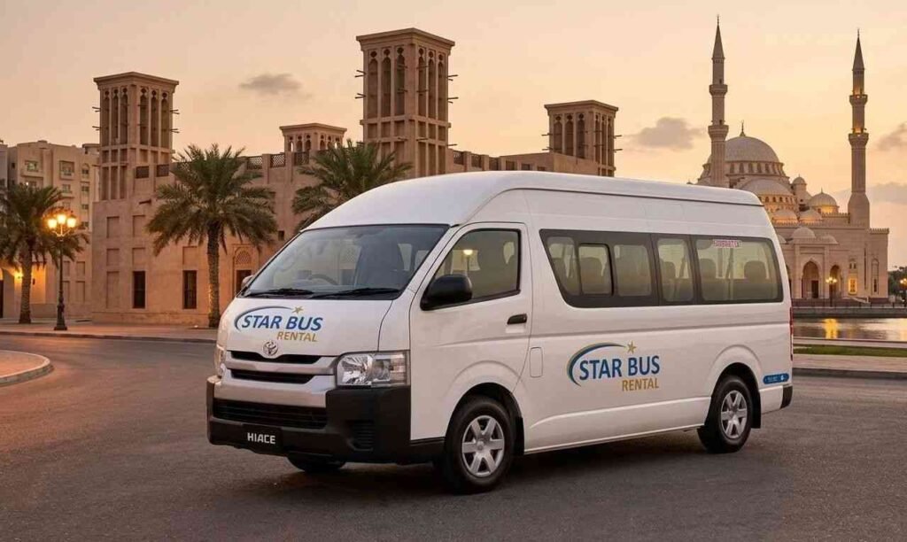 Premium white 14 seater Toyota Hiace van for rent driving on a Dubai highway with a professional driver, featuring the Star Bus Rental logo and the skyline including Burj Khalifa in the background.