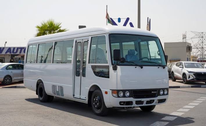 26 seater bus for rent in UAE parked in Dubai with professional driver ready for group travel